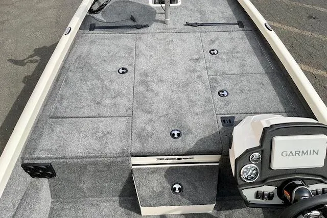 Slide: The Image of 2026 Ranger RT188P boat deck with Garmin system, gray carpet, and storage compartments. - 12