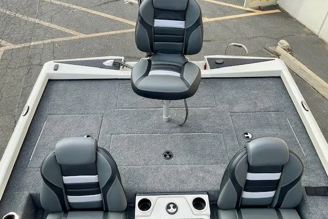 Slide: The Image of 2026 Ranger RT188P boat interior with three cushioned seats and carpeted deck. - 13