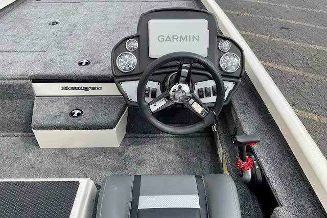 Slide: The Image of 2026 Ranger RT188P boat dashboard with Garmin display and steering wheel. - 14