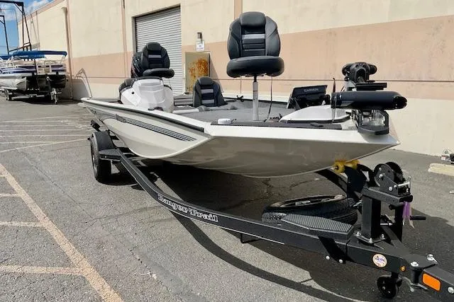 Slide: The Image of 2026 Ranger RT188P fishing boat on trailer, parked outdoors near a building. - 3