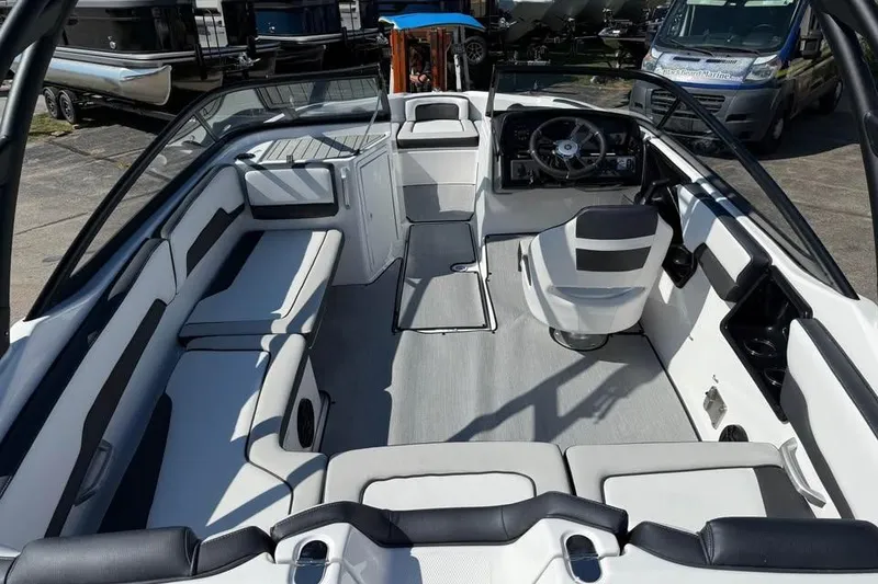 Slide: The Image of 2026 Yamaha Boats AR195 interior with sleek seating and modern dashboard design. - 6