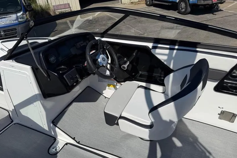 Slide: The Image of 2026 Yamaha Boats AR195 cockpit with steering wheel and captain's seat. - 7