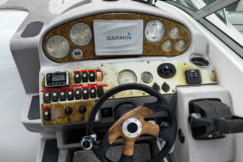 Slide: The Image of 2007 Rinker 300 Fiesta Vee boat dashboard with Garmin navigation system and control panel. - 10