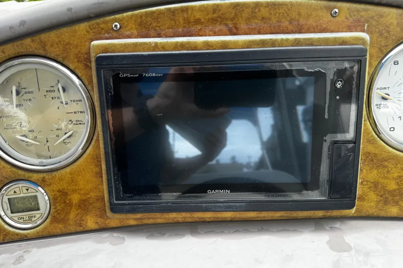 Slide: The Image of Dashboard of 2007 Rinker 300 Fiesta Vee with Garmin GPS and gauges. - 15