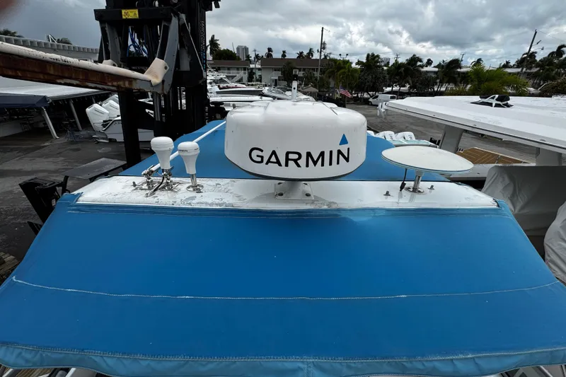 Slide: The Image of 2007 Rinker 300 Fiesta Vee boat with Garmin radar on blue canopy. - 20