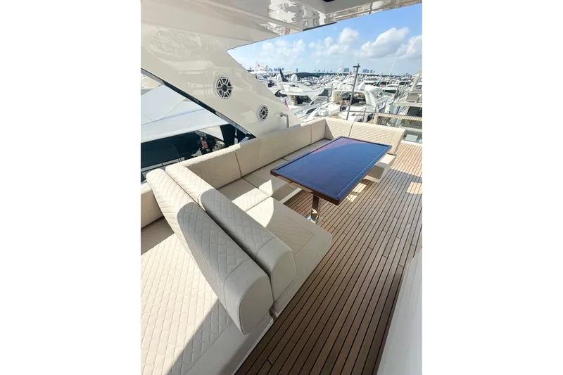 Slide: The Image of Luxurious seating area on 2026 Astondoa 66 Fly yacht with elegant wood flooring. - 14