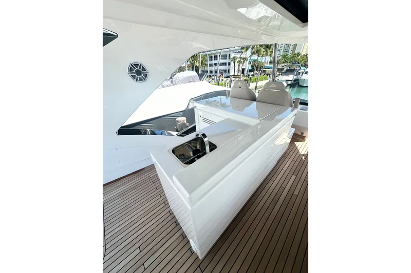 Slide: The Image of Luxurious 2026 Astondoa 66 Fly yacht deck with sleek seating and modern design. - 15