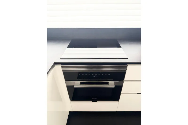 Slide: The Image of Modern kitchen appliance in the 2026 Astondoa 66 Fly yacht interior. - 17