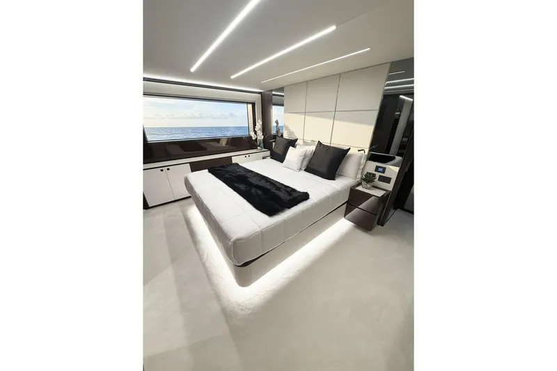 Slide: The Image of Luxurious bedroom interior of 2026 Astondoa 66 Fly yacht with ocean view. - 2