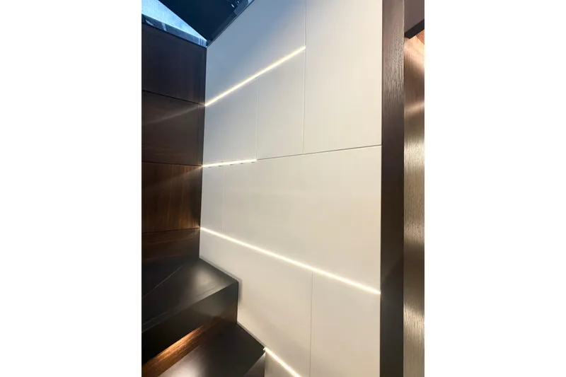 Slide: The Image of Interior of 2026 Astondoa 66 Fly yacht with modern lighting and sleek design. - 23