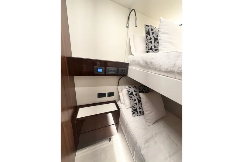 Slide: The Image of Luxurious bunk beds in 2026 Astondoa 66 Fly yacht cabin, featuring modern design and plush pillows. - 34