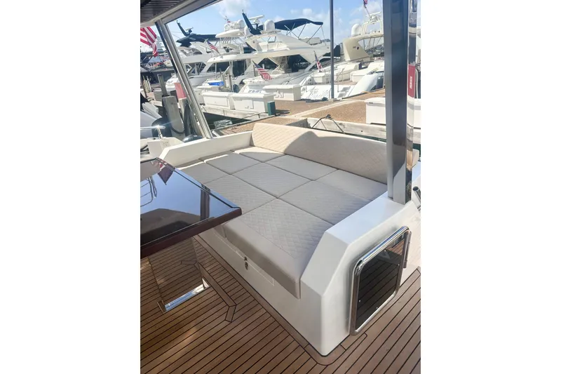 Slide: The Image of Luxurious seating area on 2026 Astondoa 66 Fly yacht, docked at marina. - 5