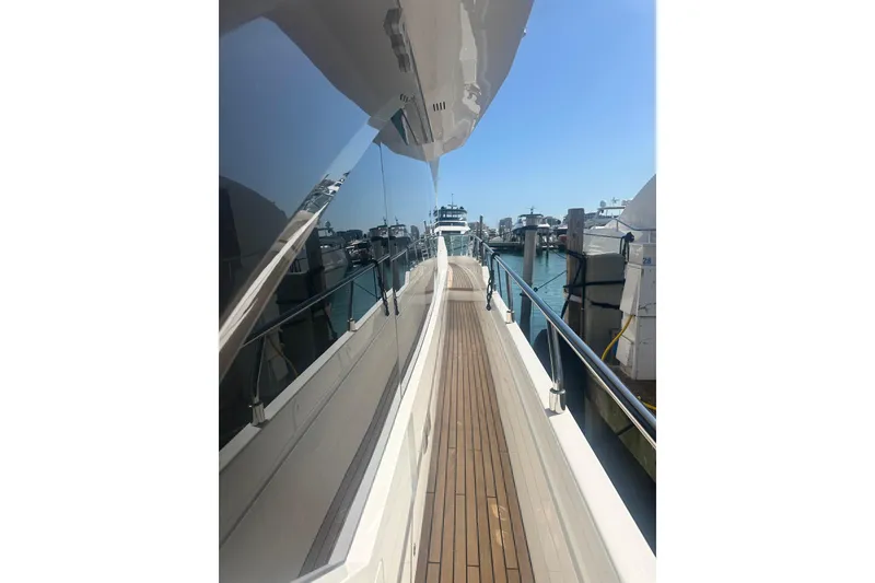 Slide: The Image of 2026 Astondoa 66 Fly yacht deck with sleek design and marina view. - 6