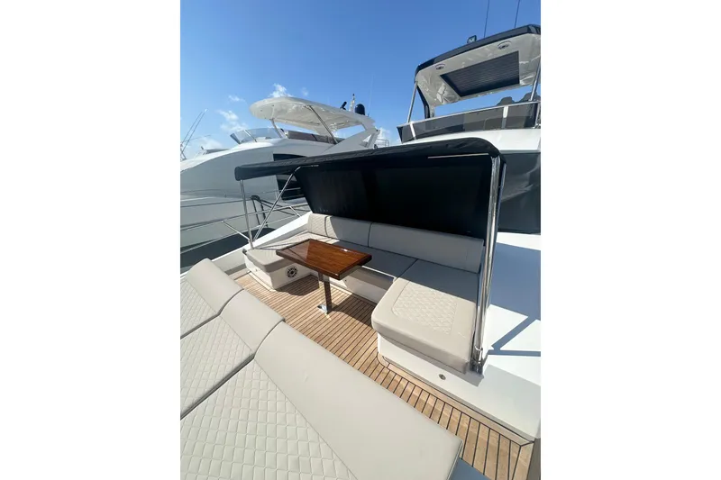 Slide: The Image of Luxurious 2026 Astondoa 66 Fly yacht with elegant outdoor seating and sleek design. - 9