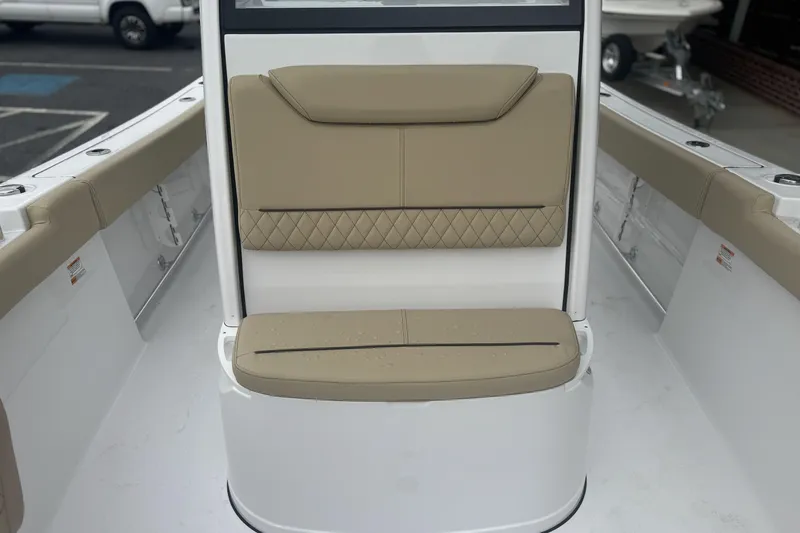 Slide: The Image of 2026 Sportsman Heritage 231 Center Console boat with tan cushioned seating. - 10