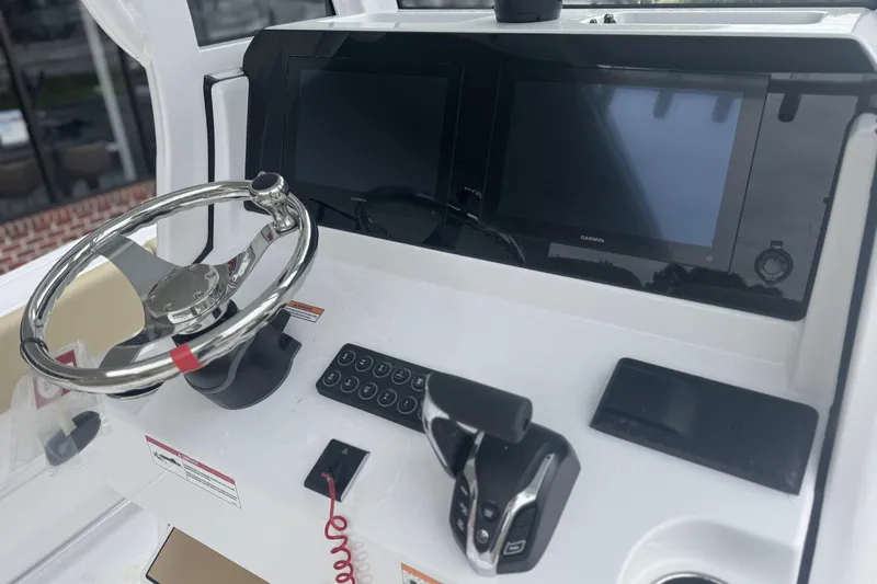 Slide: The Image of 2026 Sportsman Heritage 231 Center Console dashboard with steering wheel and digital displays. - 14