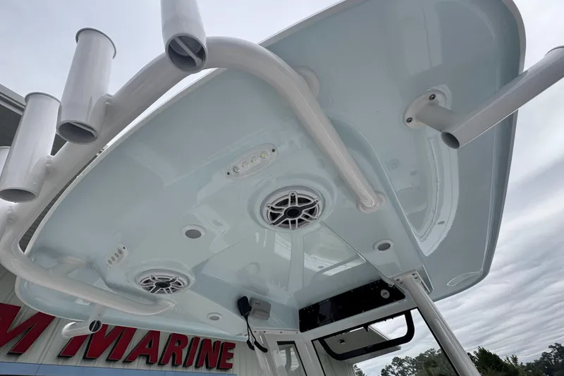 Slide: The Image of 2026 Sportsman Heritage 231 Center Console T-top with rod holders and speakers. - 15