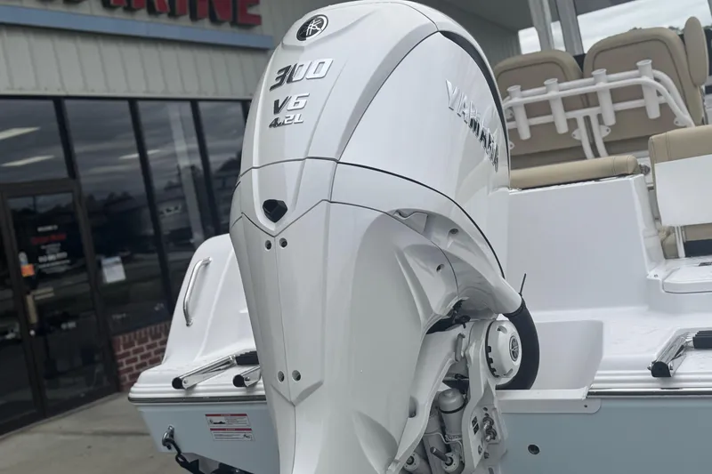 Slide: The Image of 2026 Sportsman Heritage 231 Center Console with Yamaha 300 V6 engine, displayed outdoors. - 4