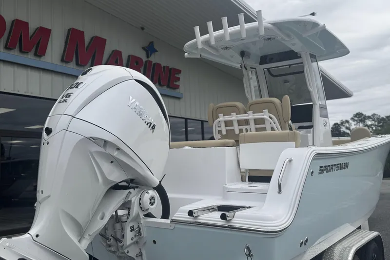Slide: The Image of 2026 Sportsman Heritage 231 Center Console boat with Yamaha engine at a marine dealership. - 7