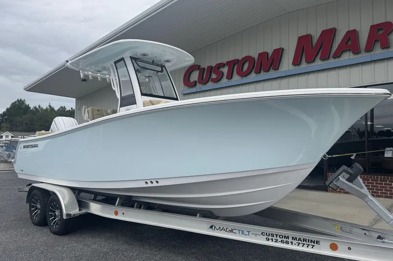 Slide: The Image of 2026 Sportsman Heritage 231 Center Console boat on trailer at Custom Marine dealership. - 8