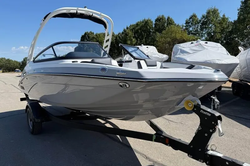 Slide: The Image of 2026 Yamaha Boats 195S on trailer, sleek design, parked outdoors. - 3