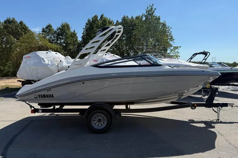 Slide: The Image of 2026 Yamaha Boats 195S on trailer, sleek design, parked outdoors. - 4