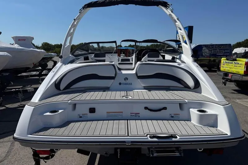 Slide: The Image of 2026 Yamaha Boats 195S, rear view, showcasing sleek design and spacious seating. - 5
