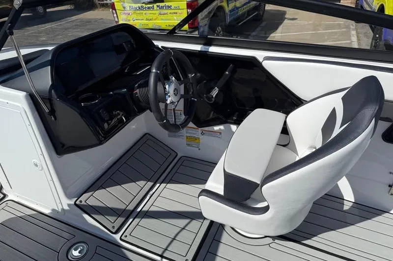Slide: The Image of 2026 Yamaha Boats 195S cockpit with sleek steering wheel and modern seating design. - 7