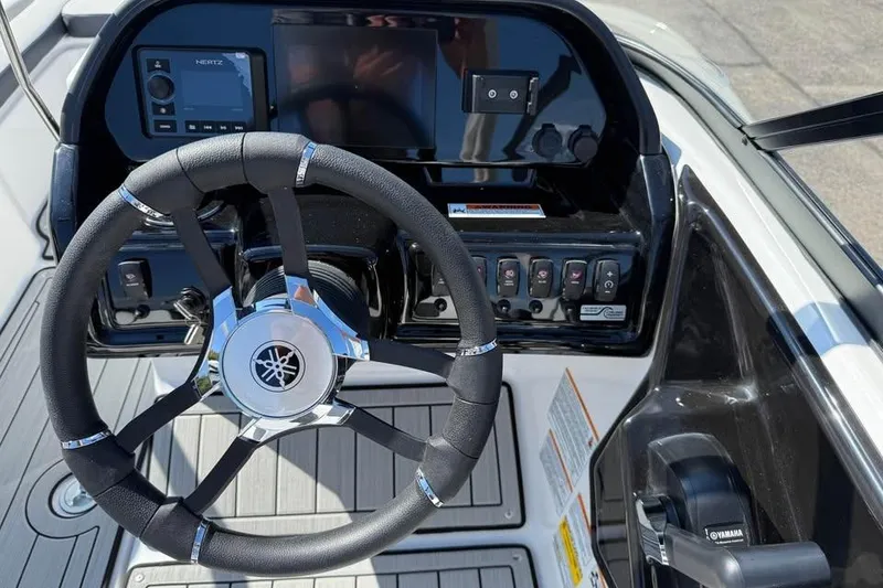 Slide: The Image of Steering console of 2026 Yamaha Boats 195S, featuring modern controls and sleek design. - 8