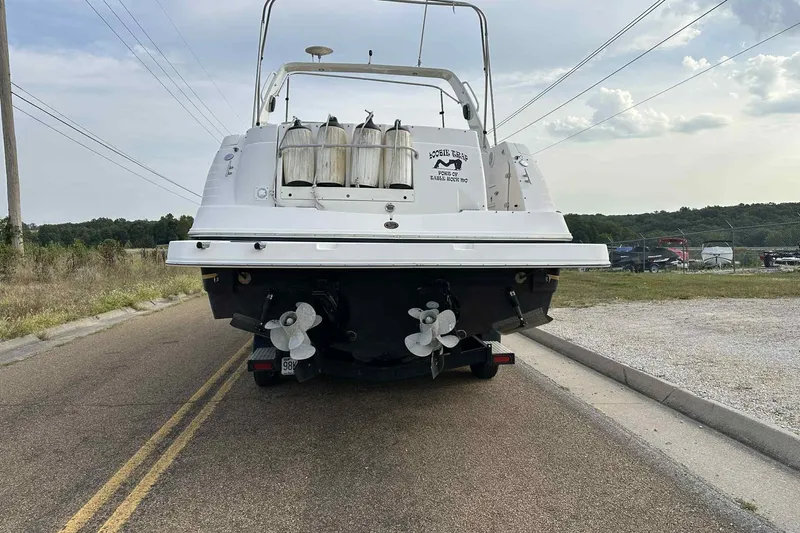Slide: The Image of 2003 Rinker Fiesta Vee 290 boat on trailer, rear view, parked on road. - 27