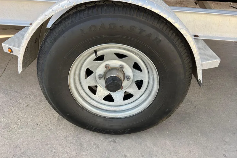 Slide: The Image of Trailer wheel of a 2017 Chaparral 19 H2O Sport boat. - 14