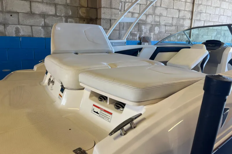 Slide: The Image of 2017 Chaparral 19 H2O Sport boat interior with white seating and dashboard. - 4
