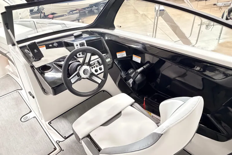 Slide: The Image of 2026 Yamaha Boats AR220 cockpit with sleek steering wheel and modern controls. - 10