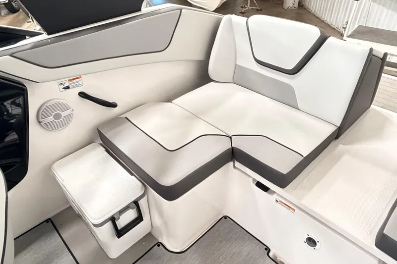 Slide: The Image of 2026 Yamaha Boats AR220 interior seating with modern design and integrated speaker system. - 11