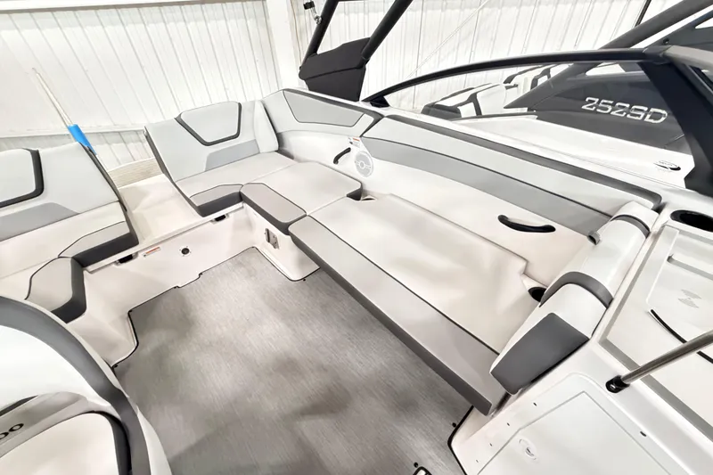 Slide: The Image of 2026 Yamaha Boats AR220 interior with sleek, modern seating and spacious layout. - 12