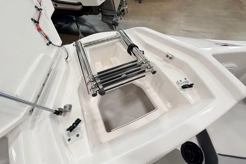 Slide: The Image of 2026 Yamaha Boats AR220 swim platform with retractable ladder and storage compartment. - 15