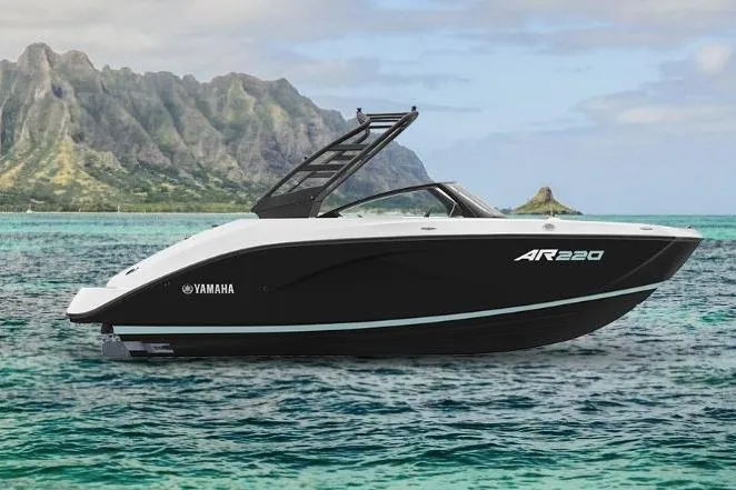 Slide: The Image of 2026 Yamaha AR220 boat on turquoise water with scenic mountain backdrop. - 7