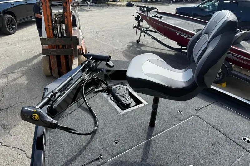 Slide: The Image of 2026 Lowe Stinger 175C boat interior with seat and trolling motor. - 10