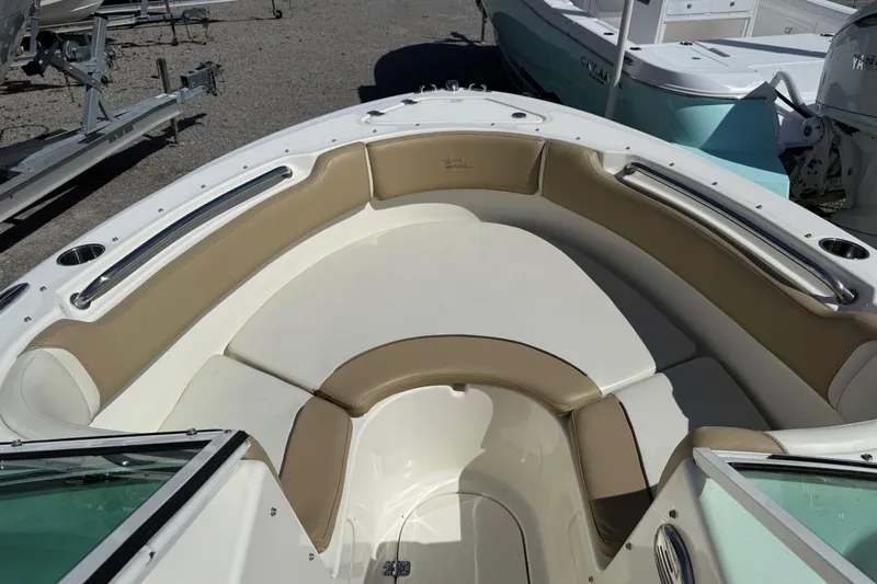 Slide: The Image of 2017 Pioneer 197 Venture boat interior with tan and white seating. - 12