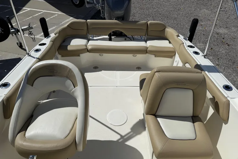 Slide: The Image of 2017 Pioneer 197 Venture boat interior with beige and white seating. - 15