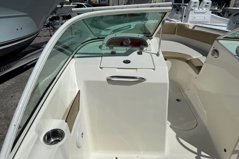 Slide: The Image of 2017 Pioneer 197 Venture boat interior with windshield and seating area. - 16