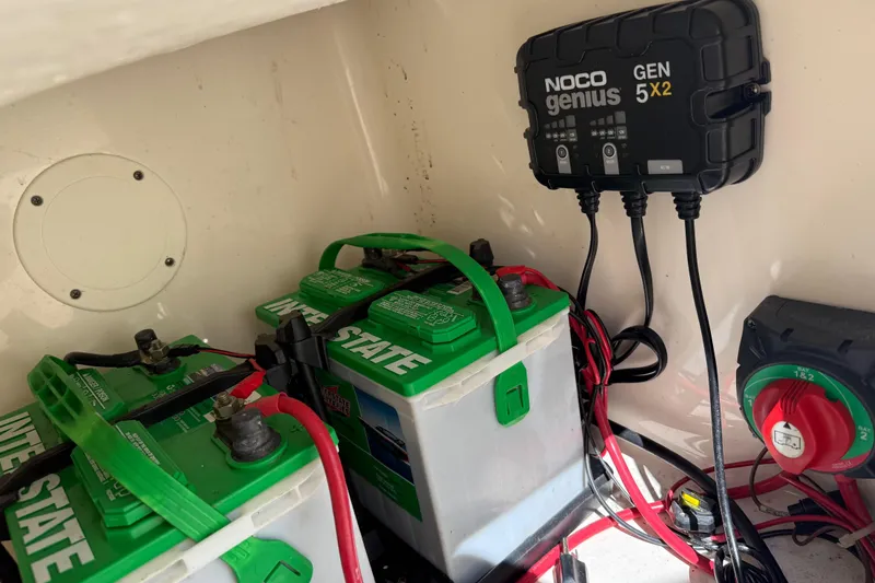 Slide: The Image of Battery setup in a 2017 Pioneer 197 Venture with NOCO Genius GEN5X2 charger. - 18