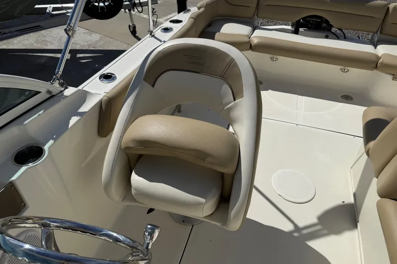Slide: The Image of 2017 Pioneer 197 Venture boat interior with beige seating and steering wheel. - 25