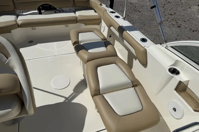 Slide: The Image of 2017 Pioneer 197 Venture boat interior with beige and white seating. - 27