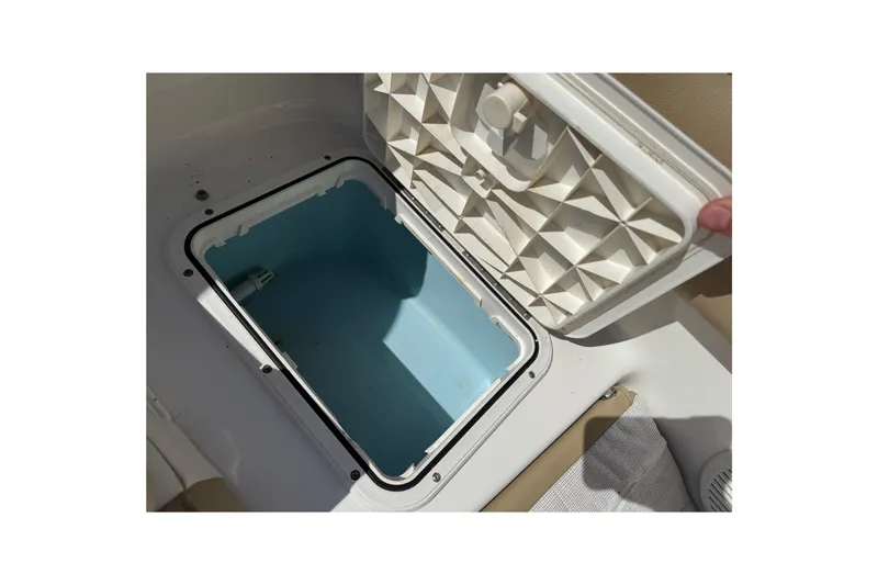 Slide: The Image of Open storage compartment on 2017 Pioneer 197 Venture boat, showing interior details. - 28