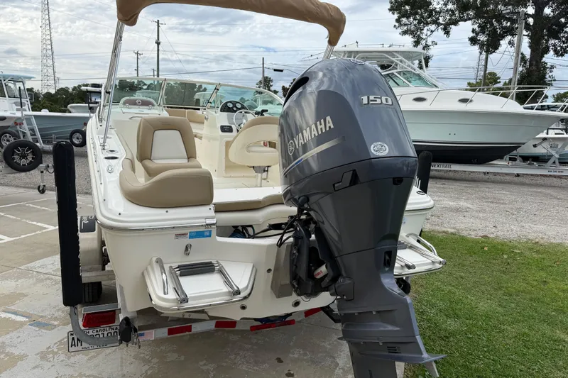 Slide: The Image of 2017 Pioneer 197 Venture boat with Yamaha 150 engine, docked outdoors. - 8