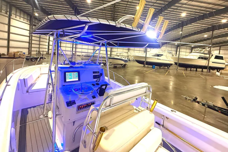 Slide: The Image of 1999 Pursuit 2870 Center Console GPS display with navigation and sonar options. - 13