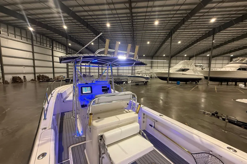 Slide: The Image of 1999 Pursuit 2870 Center Console radio and communication equipment panel. - 14