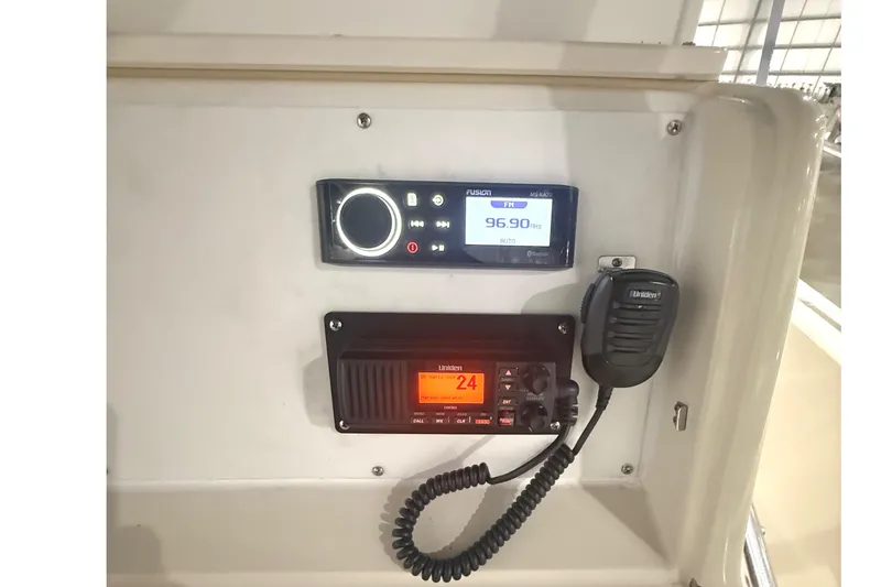 Slide: The Image of 1999 Pursuit 2870 Center Console boat interior with seating and navigation equipment. - 16