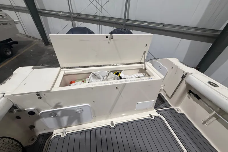 Slide: The Image of 1999 Pursuit 2870 Center Console helm with Garmin display and communication equipment. - 22